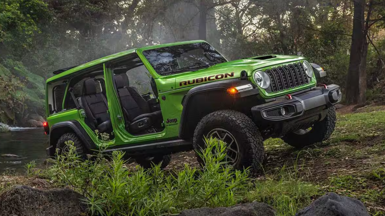 Green 2026 Jeep Wrangler driving off-road